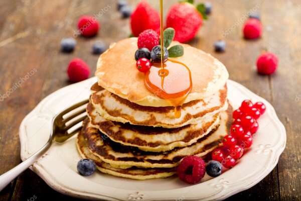 Pancakes on wooden table