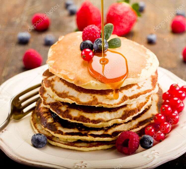Pancakes on wooden table